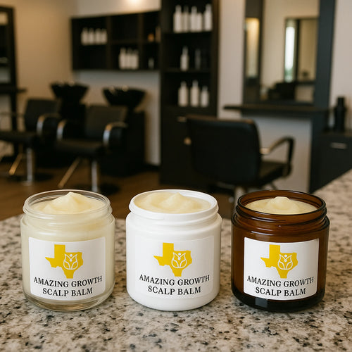 Sample size jars of Amazing Growth Scalp Balm in clear, white, and amber containers on a salon counter