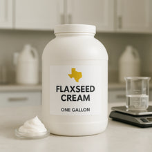 Load image into Gallery viewer, One gallon jar of Texas WNBS Flaxseed Cream on lab counter with beaker and scale, thick whipped natural hair product
